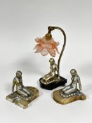 A pair of Art Deco silvered coated kneeling female figure bookends, mounted on alabaster bases and a