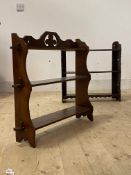 An Arts and Crafts period mahogany three tier wall shelf of pegged construction (H59cm) and