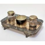 An Edwardian Epns double ink stand, the rectangular top with gallery border and centre glass inset