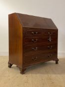 A George III boxwood strung mahogany bureau, the fall front revealing a well fitted interior over