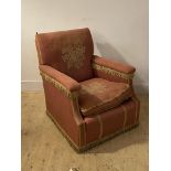 An early 20th century upholstered armchair (A/F) H90cm, W75cm