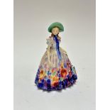 A Royal Doulton china figure Easter Day, HN2039, signed TM, (h 20cm x 14cm x 12cm) decorated with