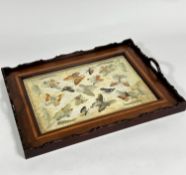 An Edwardian mahogany inlaid two handled tea tray with inset sewn work panel with butterflies and