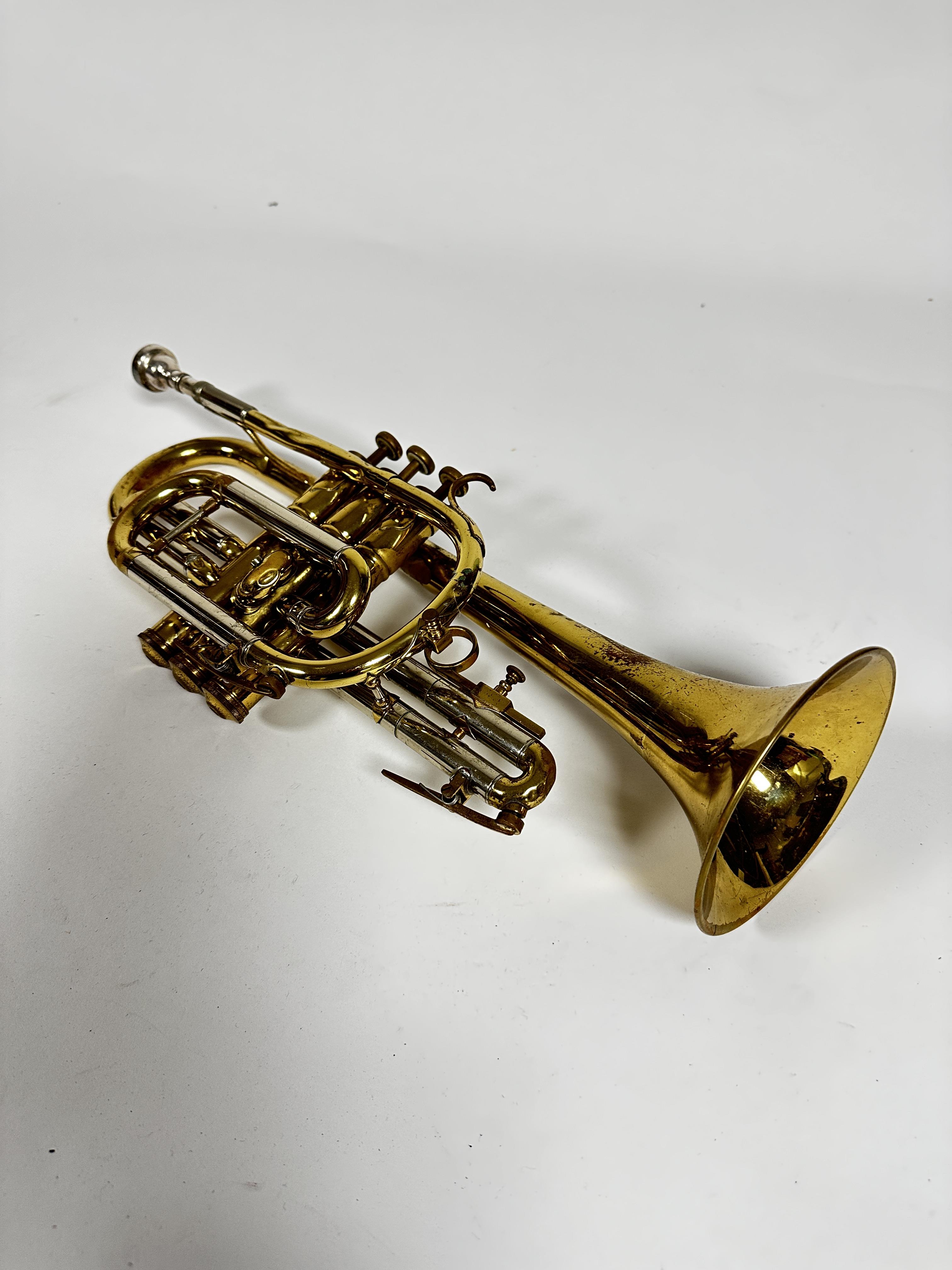 A Besson Concorde trumpet complete with mouthpiece and mother of pearl tops, slight dent to top