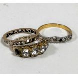 A 9ct gold paste set five stone graduated ring, a yellow metal clear stone set eternity style ring