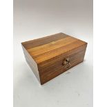 A Victorian walnut box, the rectangular hinged top with inset brass shield, enclosing a fold out