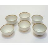A set of six 19thc English china fluted tapered tea bowls with gilt lips and internal floral gilt