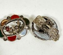 A sterling silver oval Scottish hardstone brooch with double thistle centre panel, one missing