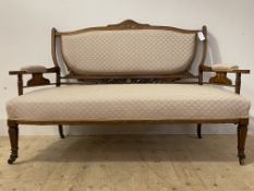 An Edwardian inlaid rosewood and upholstered settee, the shaped open back with carved acanthus