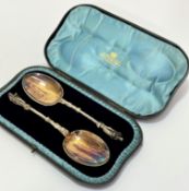 A pair of Epns apostle handled serving spoons complete with original presentation box, retailed by J
