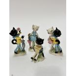 A Hummel collection of four various novelty cat figures including a courting couple, a female cat