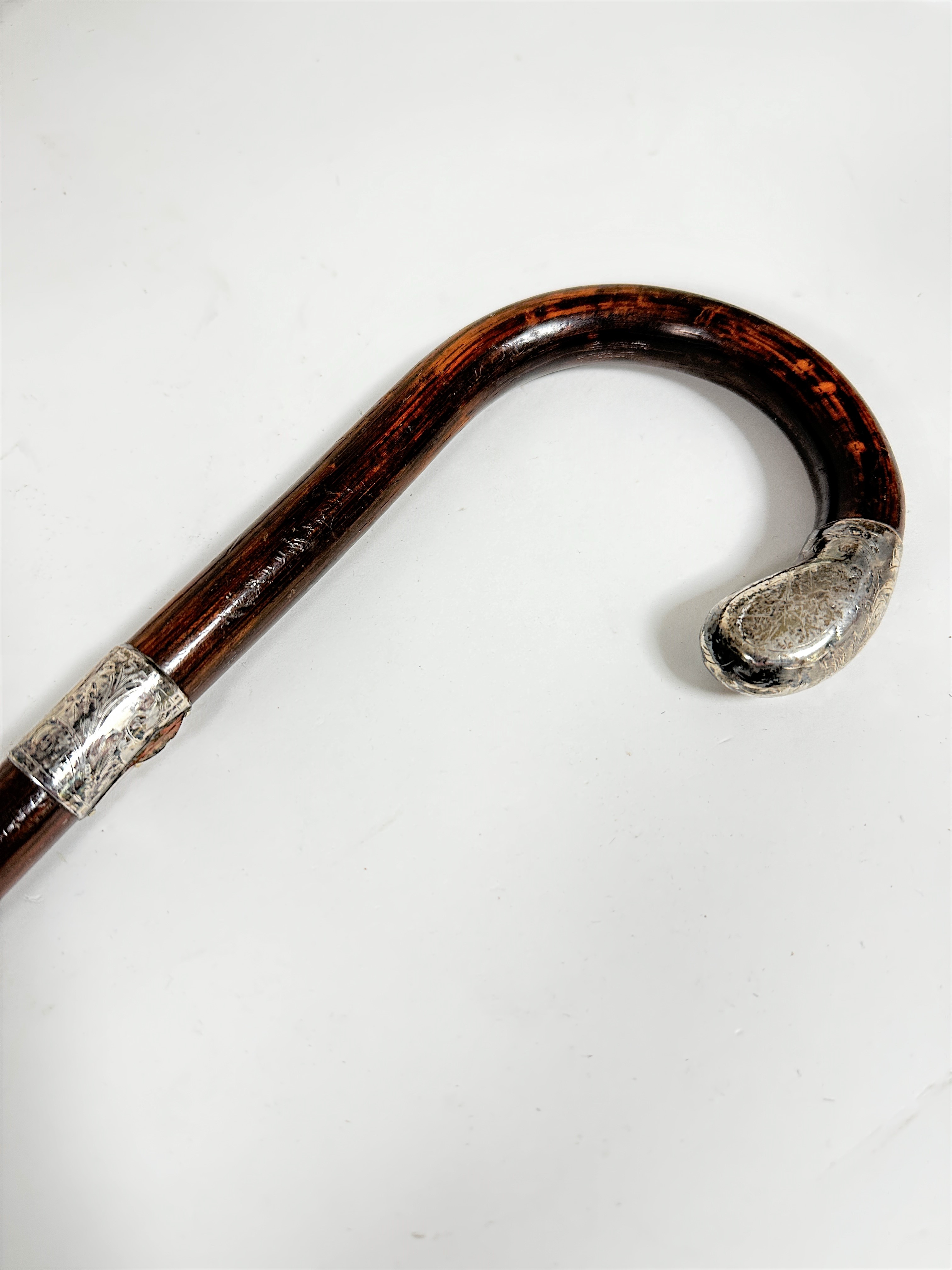 A copper coaching horn with brass mounted tip, (L 89cm) and a stained silver mounted walking - Image 2 of 2