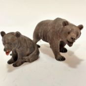 Two Bavarian carved wooden brown bear figures, a mother and her cub, with inset glass eyes and