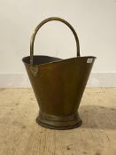 A 19th century brass coal bucket with swing handle and moulded base H34cm
