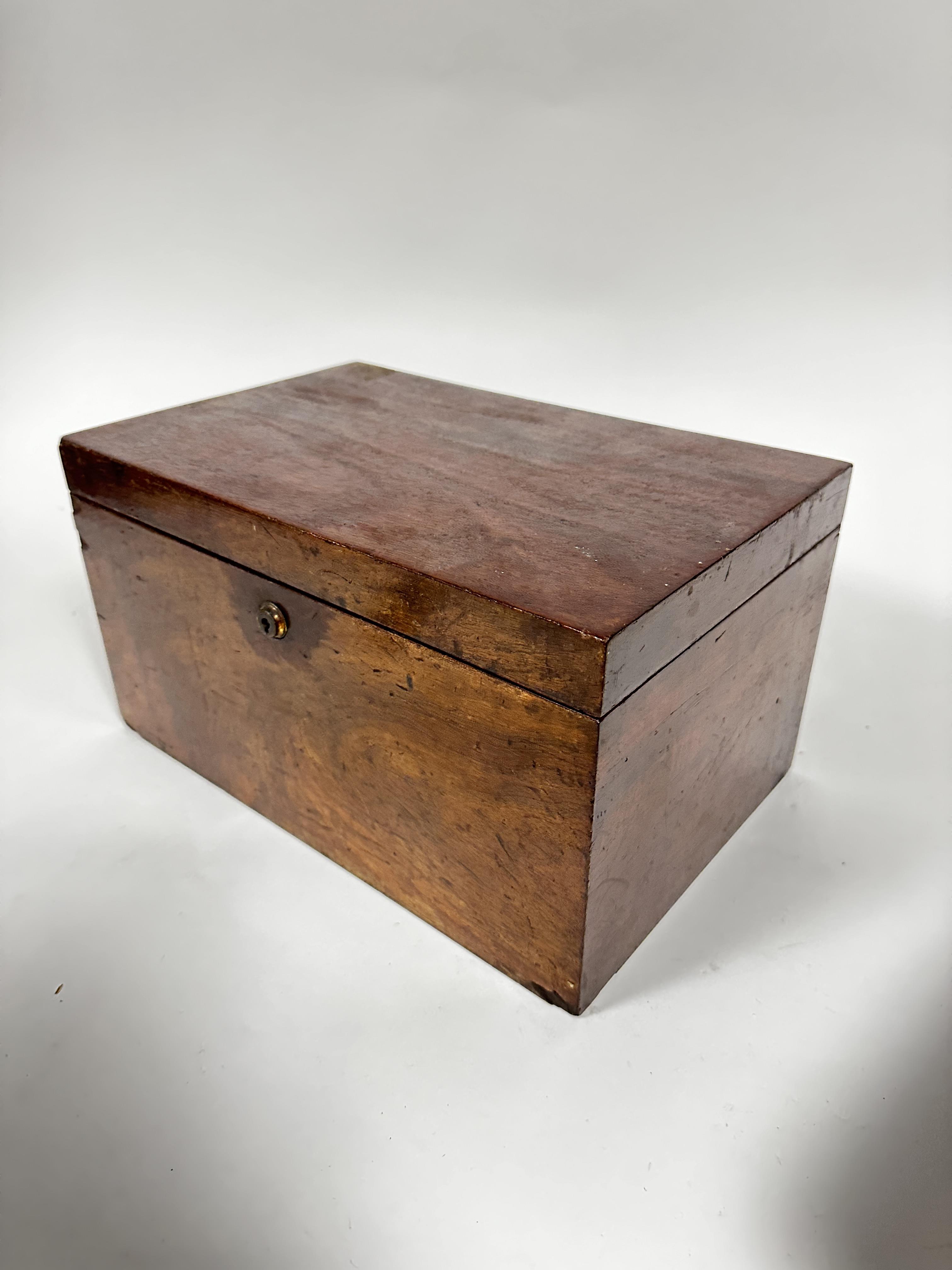 A 19thc mahogany collectors box the rectangular hinged top enclosing four removable trays, slight