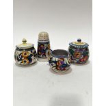 A Poole pottery 1920s style sugar shaker of tapered cylinder form, with pierced top and stylised