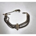 A silver Edwardian Albert with centre chased oval bead surmounted panel with five various fancy link