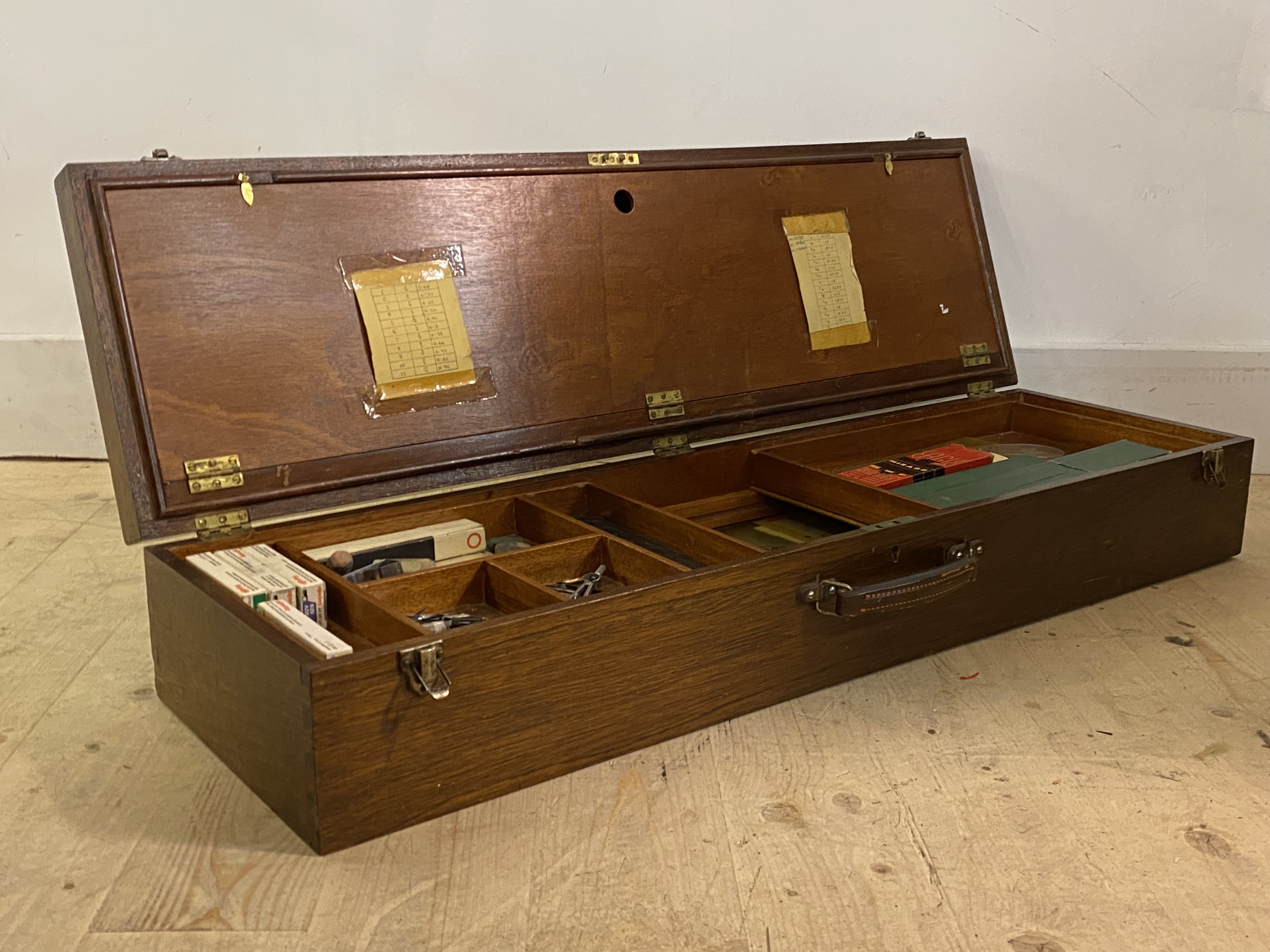 A large mahogany draftsman box, the hinged lid revealing interior fitted with sliding lift out