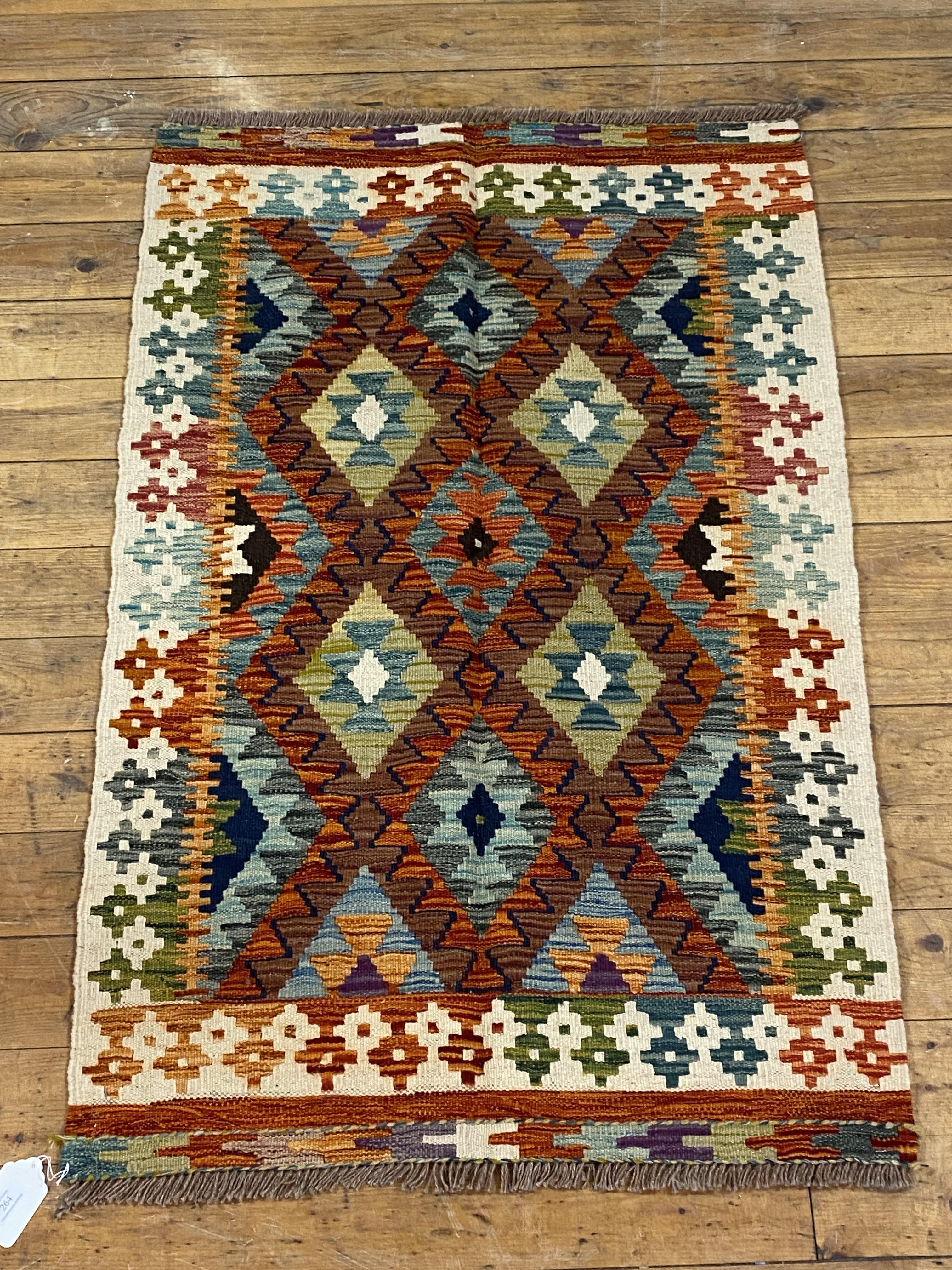 A Chobi kilim rug, of typical geometric design, 127cm x 84cm
