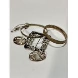 A modern Birmingham silver textured stiff hinged bangle, (d 6.2cm x 5.5cm), a white metal leaf and
