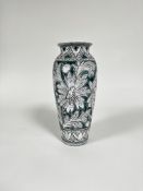 An Italian mid century tapered cylinder vase with incised floral and leaf decoration, turquoise