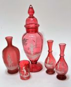 An Edwardian cranberry glass Mary Gregory style decorated baluster vase complete with domed cover