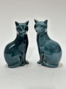 A pair of Poole pottery green / blue seated cats with black tipped tails, (17cm x 10cm x 6cm)