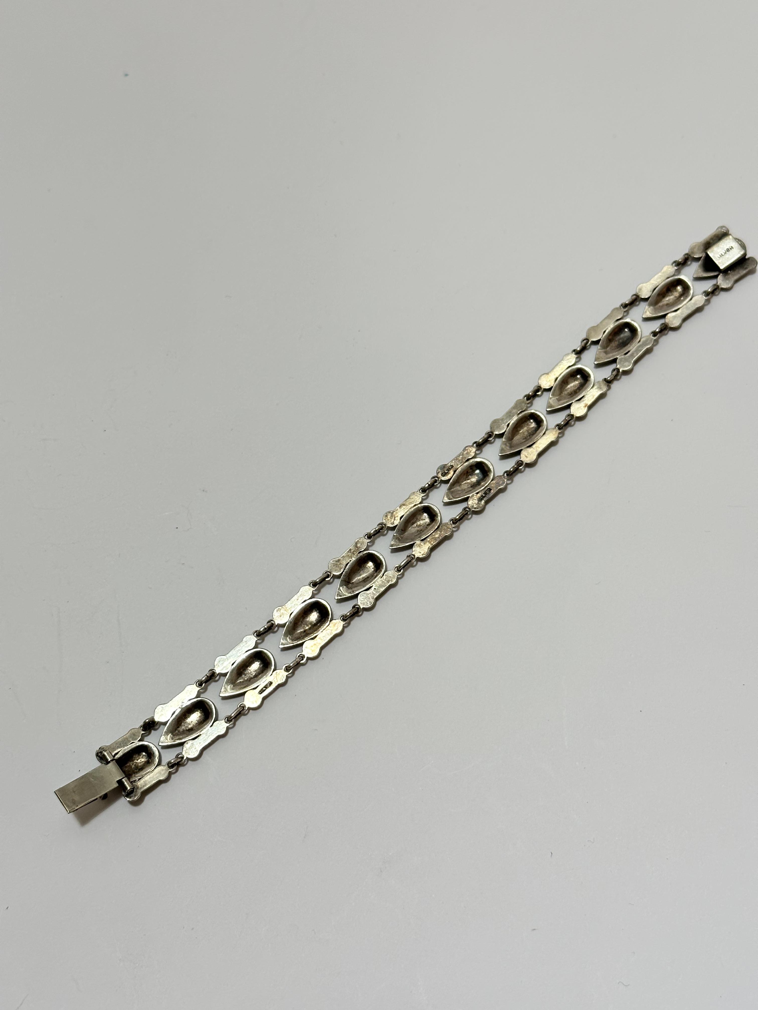 A silver Norwegian style navette shaped enamelled articulated bracelet with enamelled panels to side - Image 2 of 2