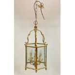 A lacquered brass hexagonal hanging lantern, with inset glass panels H90cm