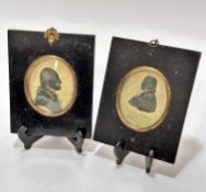 A pair of early 19thc ebonised portrait miniature frames with prints depicting George Washington and