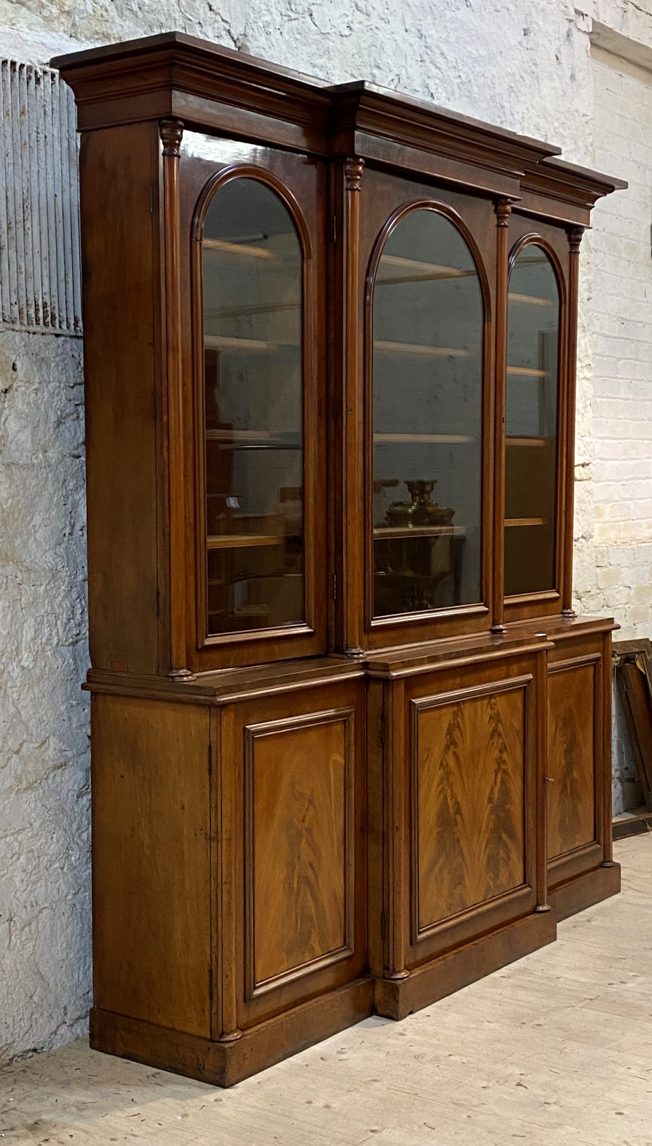 A Good Victorian mahogany breakfront bookcase, the the projecting cavetto moulded corner over - Image 2 of 2