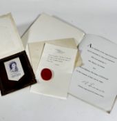 A card containing a tassel made of the Lullingstone silk which was used in Coronation robes of the