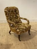 A Victorian mahogany drawing room chair, upholstered in buttoned floral chenille fabric