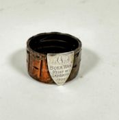 Trench Art:- A copper Boer War napkin ring of circular form with white metal shield plaque, AAF Boer