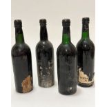Four bottles of vintage port including Cockburn's Vintage 1967 (2) stamped to top, one label