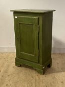 A 19th century green painted cupboard the single panelled door enclosing interior fitted with shelf,