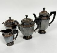 An Epns Edwardian paneled French four piece tea and coffee service with painted treen handles, (