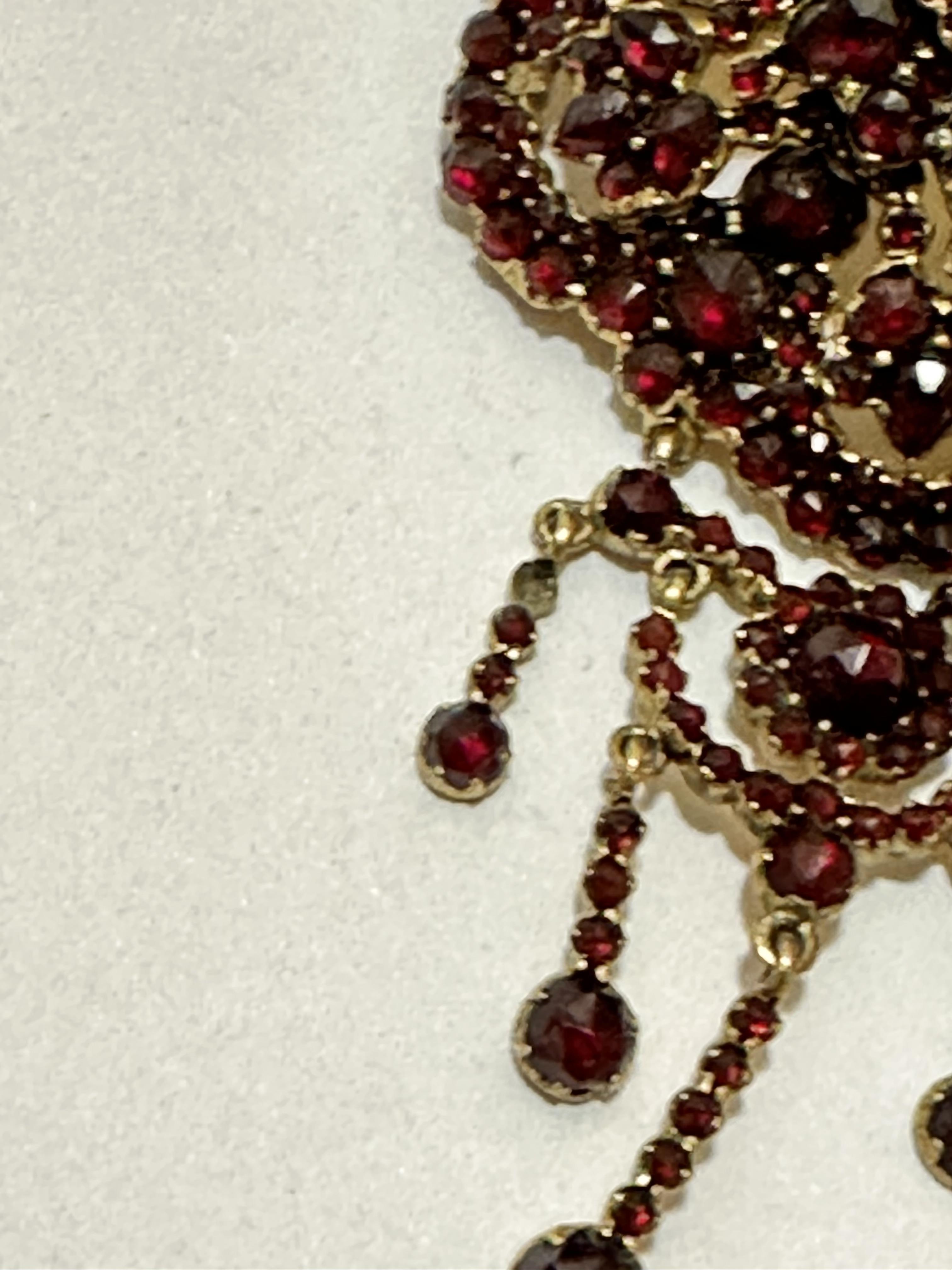 A late 19th early 20thc garnet cluster brooch with centre cluster and swags with drops, some - Image 2 of 5