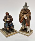 A pair of late 19thc early 20thc Naples figures of a man with dog and begging cup, raised on