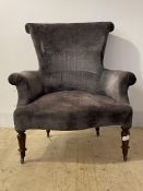 A Generous Victorian drawing room chair, scroll back, arms and seat upholstered in grey velvet,