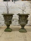 A pair of reconstituted stone garden urn planters, flared rim over twin handled body with Romo-
