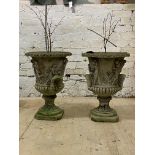 A pair of reconstituted stone garden urn planters, flared rim over twin handled body with Romo-