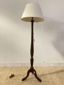 A Georgian style mahogany standard lamp, early 20th century, reeded and waterleaf carved column on
