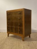 A mid century walnut chest by Lebus, circa 1960's, fitted with four drawers, raised on square