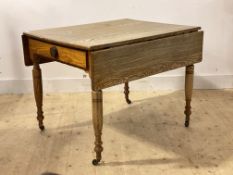 A Victorian oak and pine scrub top work kitchen table, two drop leaves over drawer to each end,
