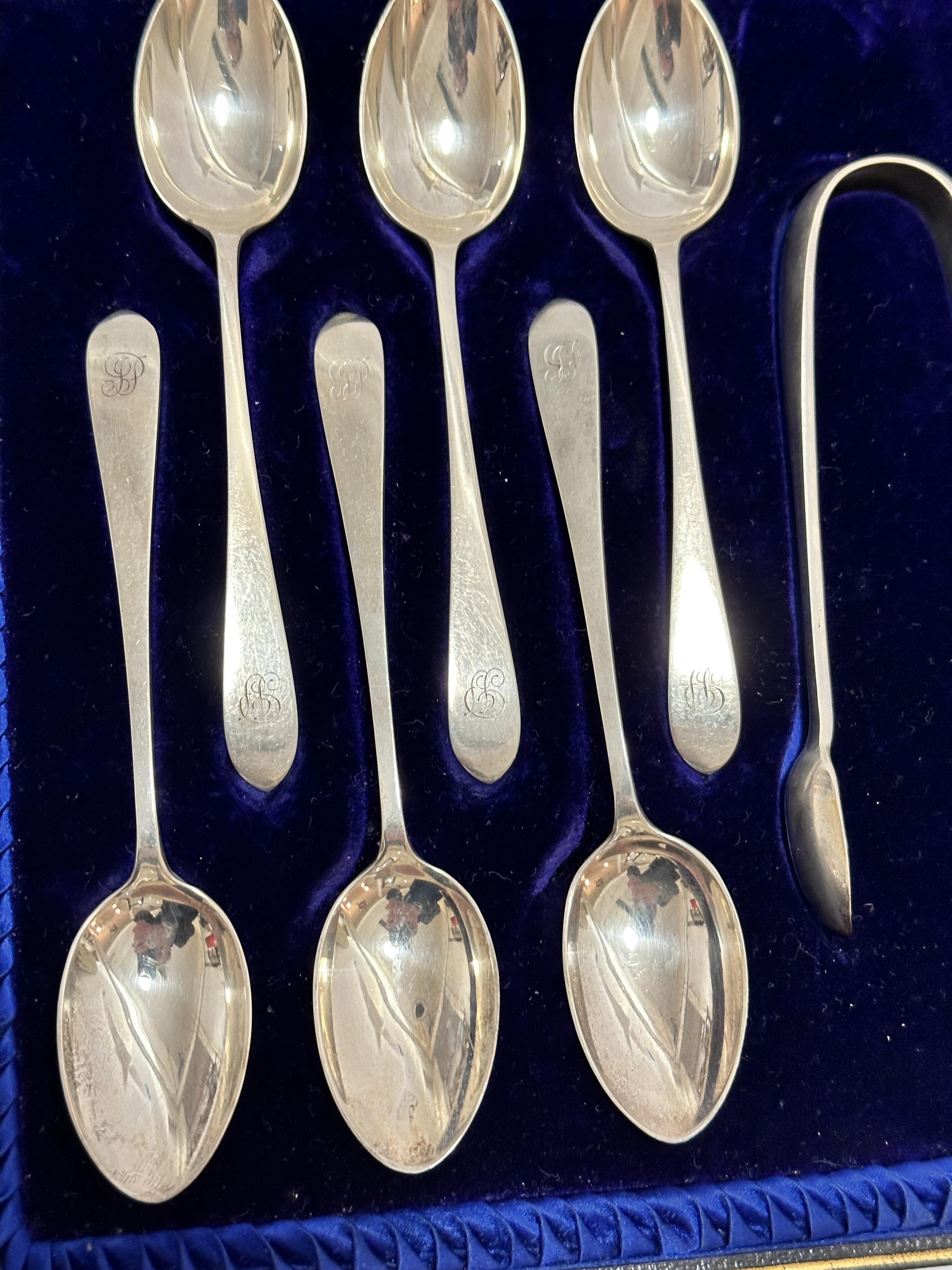 A set of twelve Sheffield silver old English pattern teaspoons complete with tongs with engraved - Image 2 of 2