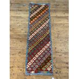 A Chobi kilim runner rug of typical geometric design, 197cm x 60cm