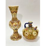 A Zsolnay Pecs Hungarian pottery baluster vase of flared top, bulbous centre and spreading base,