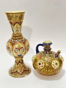 A Zsolnay Pecs Hungarian pottery baluster vase of flared top, bulbous centre and spreading base,