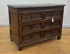 An oak mule chest, 18th century and later, the hinged top with egg and dart moulded border opening